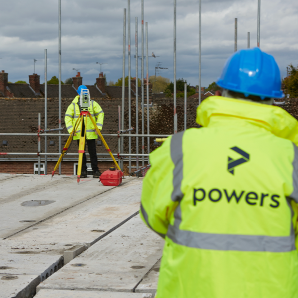 Powers team on a construction site doing setting out, using a total station
