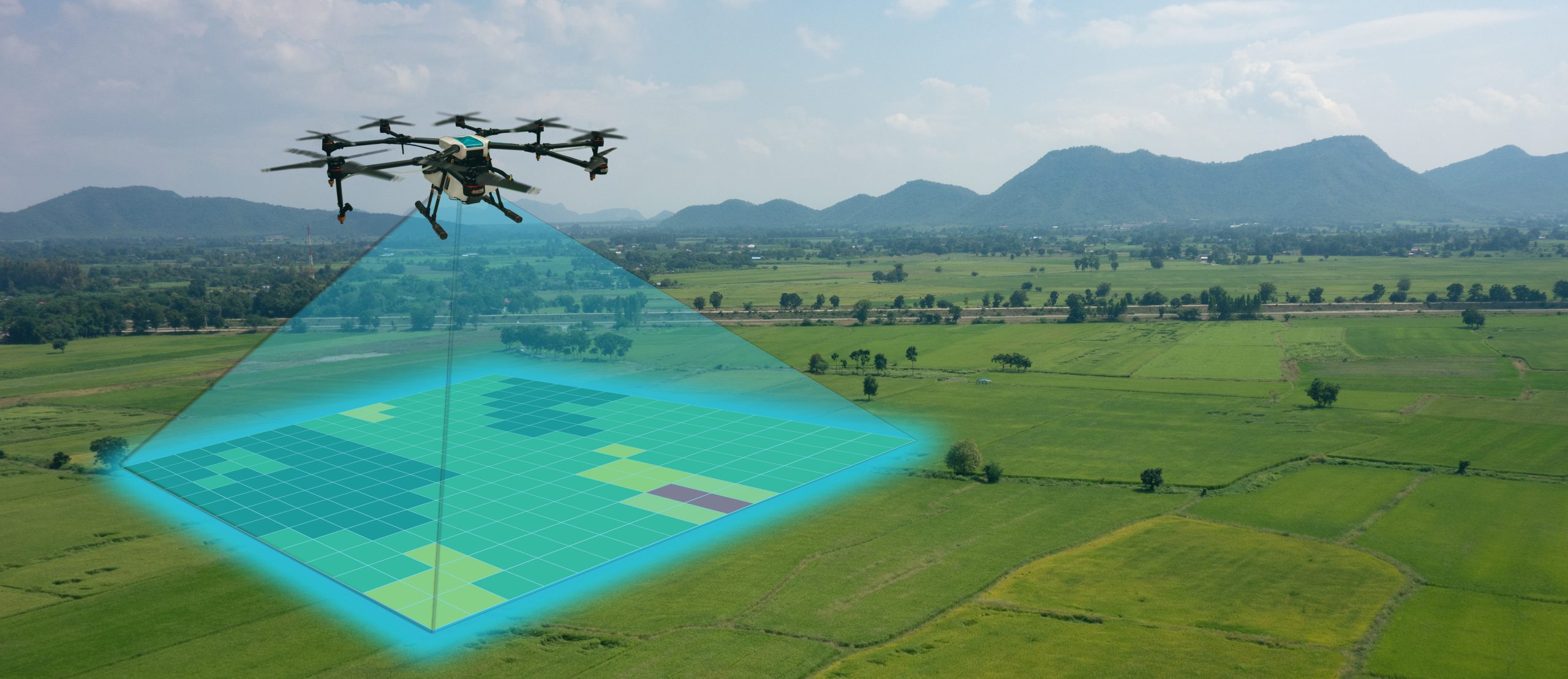 Drone being used for land surveying and mapping the ground below it. Shows lasers from drone on the ground in a square format