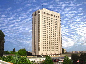 a tall hotel on a blue sky background