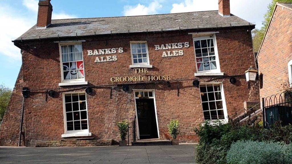 a brick pub, which is leaning to the left