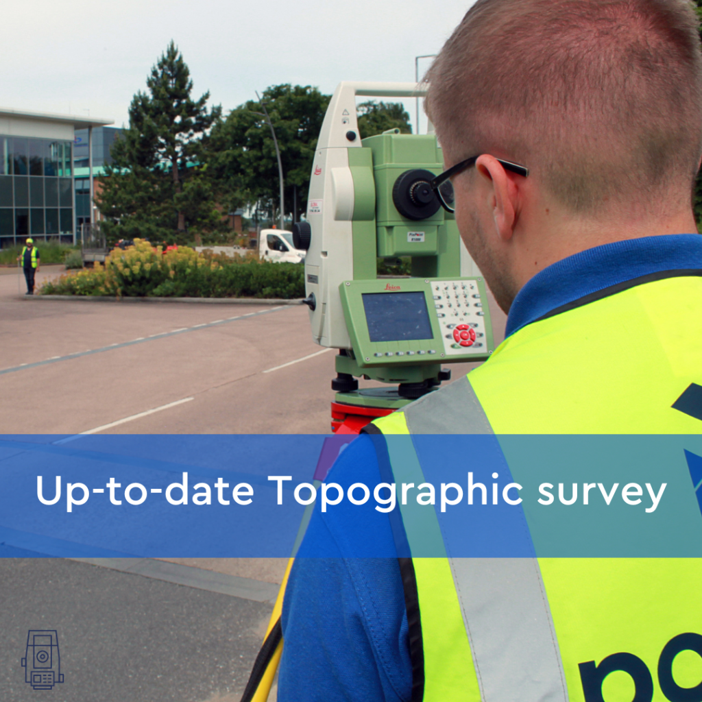 young lad, with his back to the camera, in a hi-vis jacket. Stood with a total station conducting a topographical survey