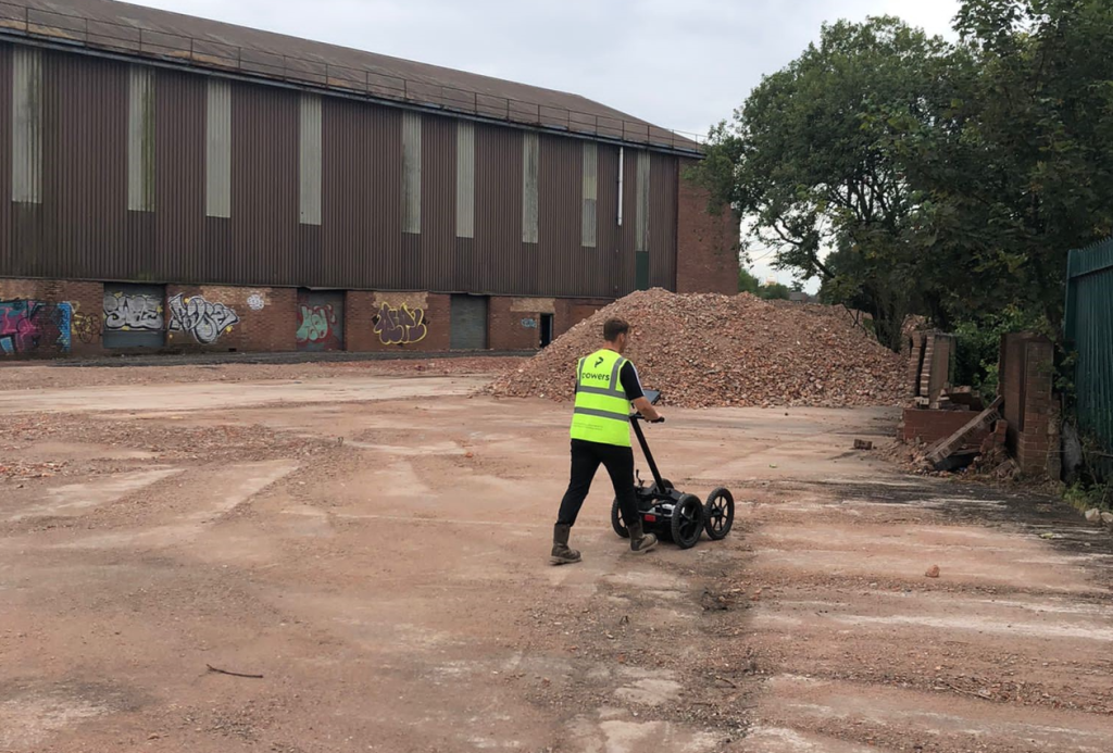 Surveyors on a site conducting an underground utility detection survey